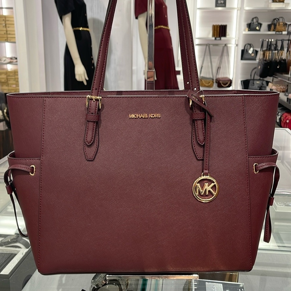Michael Kors Gilly Large Drawstring Travel Leather Top Zip Tote 
Oxblood Color - Picture 16 of 16